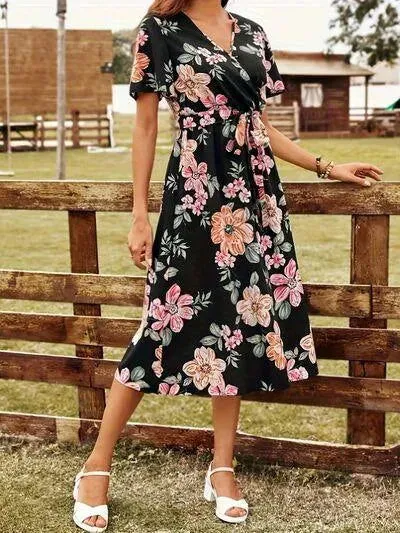 Discover the Charm: Black Surplice Dress with a Floral Print